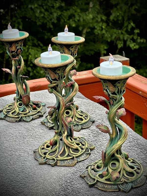 Completed hand-painted botanical candle holders for a wedding